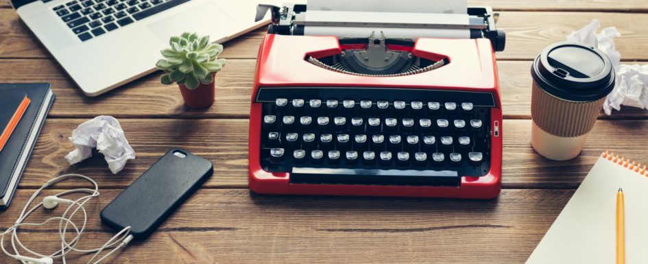 Vintage typewriter on wooden background
